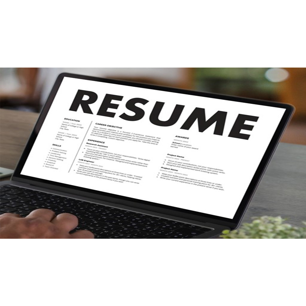 A woman conducting a mock interview with a man, both seated at a table with documents and a water bottle.
